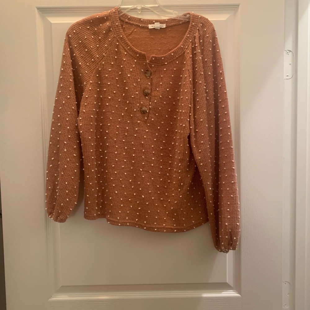 Orange sweater with polka dots